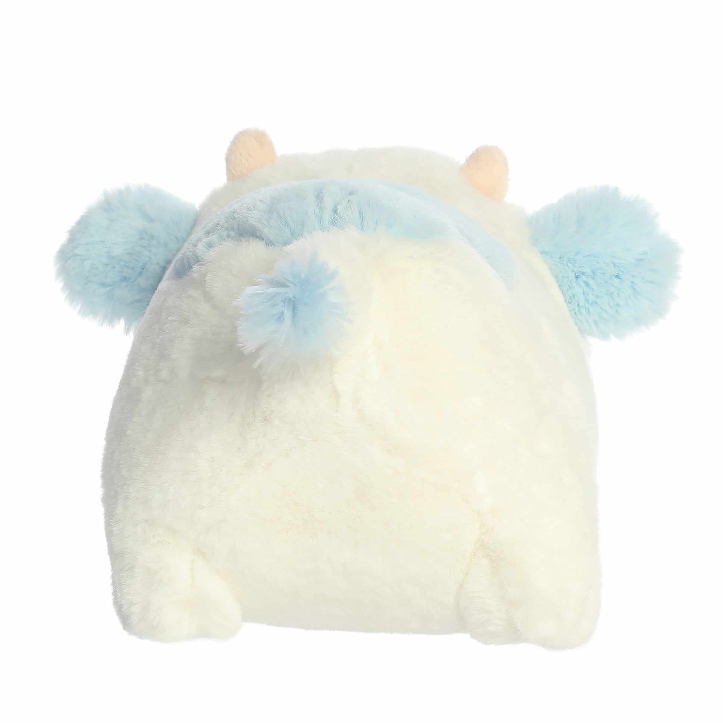Back view of A product photo of the 10-inch Aurora Spudsters Bonnie Blueberry Cow, a white, potato-shaped plush cow with soft blue spots and a pink nose.