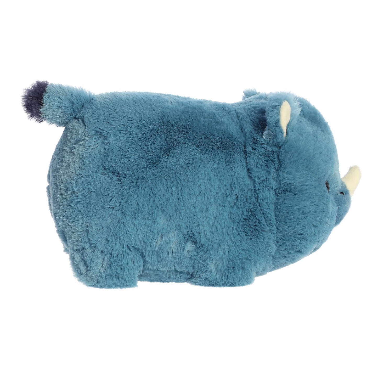 Side view of A product photo of the 10-inch Aurora Spudsters Rio Rhino, a bold blue, potato-shaped rhino plush with a small white horn.