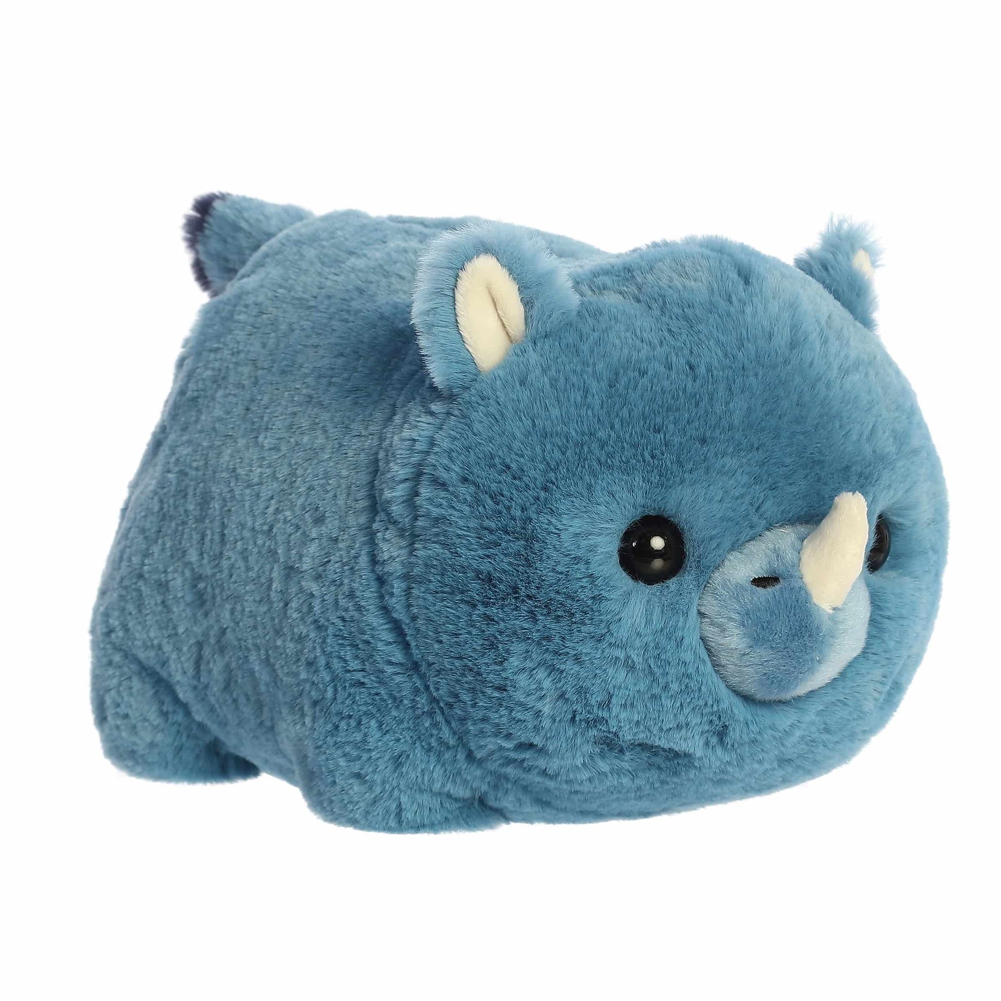 A product photo of the 10-inch Aurora Spudsters Rio Rhino, a bold blue, potato-shaped rhino plush with a small white horn.