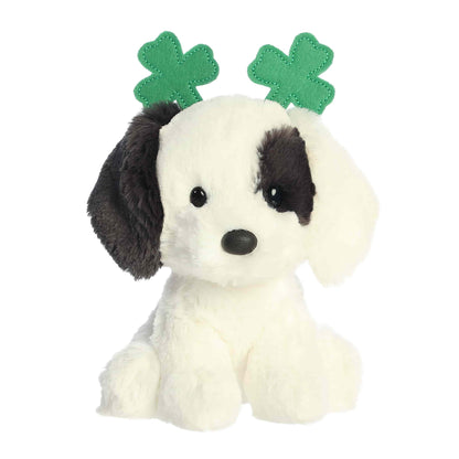 Aurora St. Patrick's Day Clover Dog 6-inch plush soft toy, a white dog with black patches and a green shamrock headband.