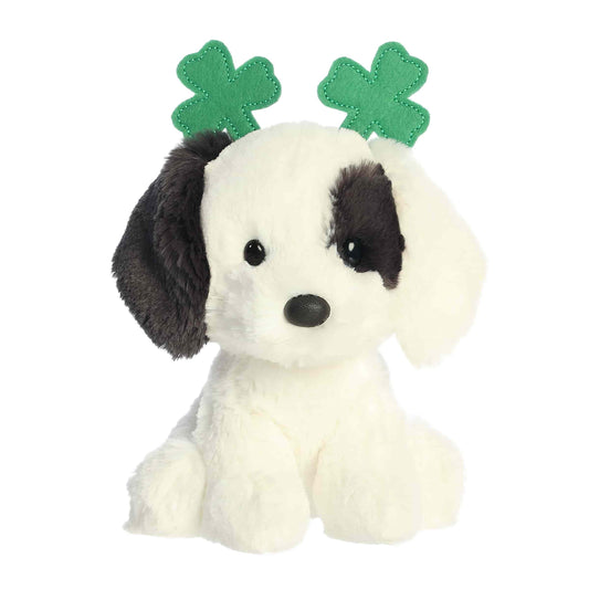 Aurora St. Patrick's Day Clover Dog 6-inch plush soft toy, a white dog with black patches and a green shamrock headband.