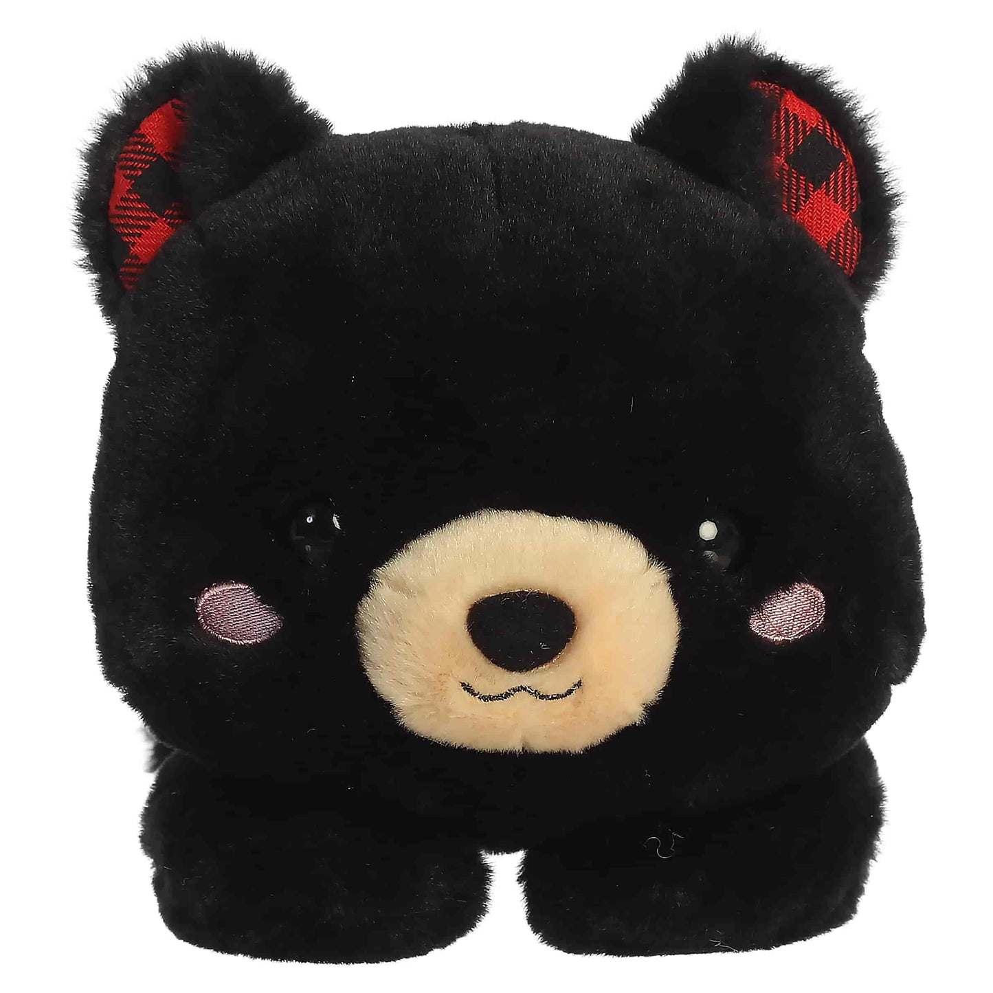 Aurora Too Cute Ben Black Bear plush lying belly-down featuring soft black fur, a tan snout, rosy cheeks, and red buffalo plaid inner ears.