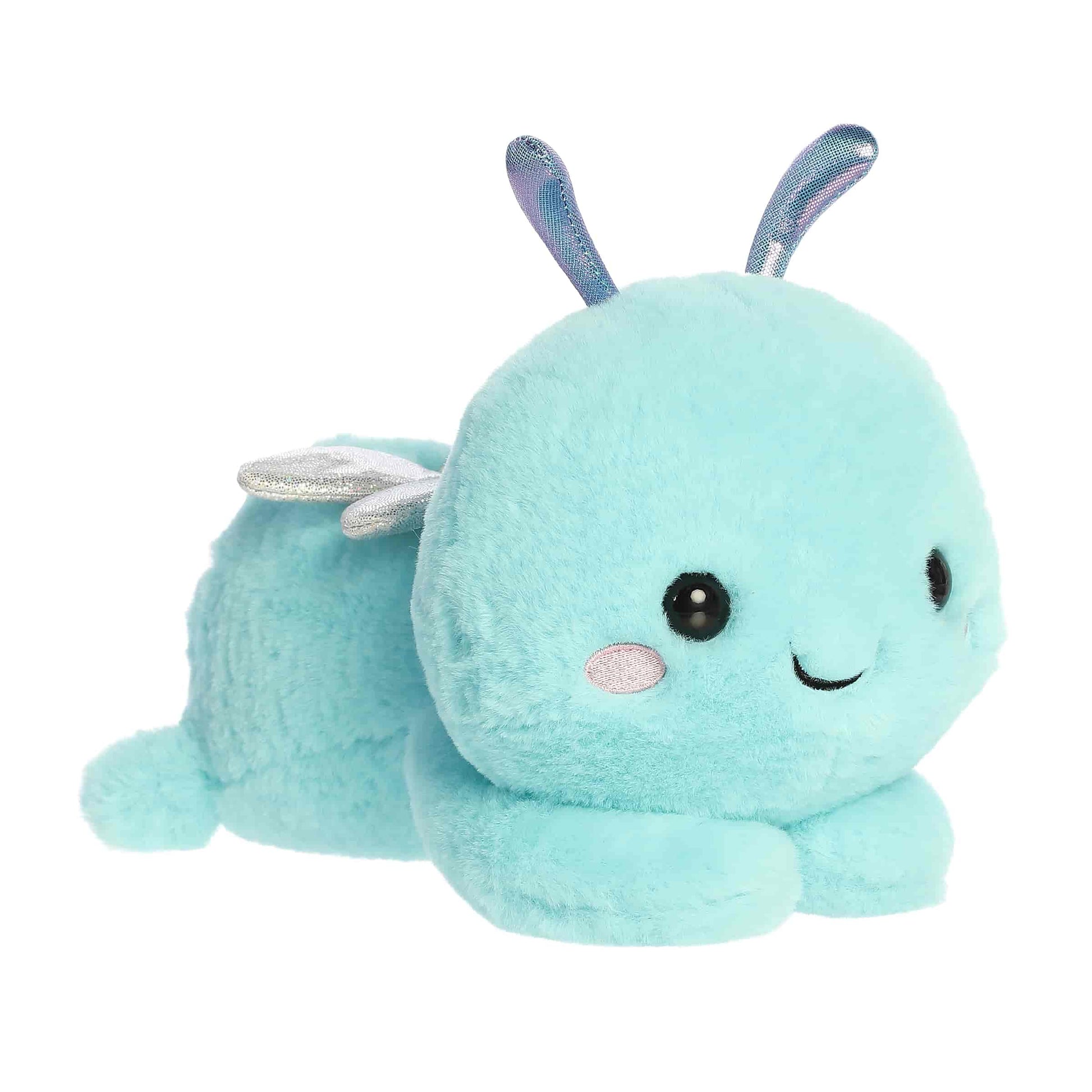 Aurora Too Cute Dani Dragonfly 9.5-inch plush, a sky blue dragonfly with sparkling silver wings lying belly down.