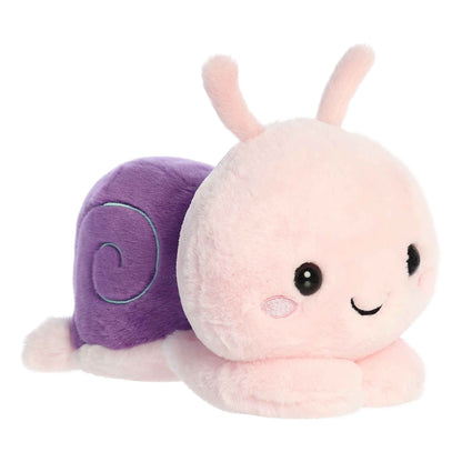 A product photo of the 9-inch Aurora Too Cute Sena Sea Snail plush, a pink snail with a purple shell, shown lying belly-down with its paws sprawled out on a white background.