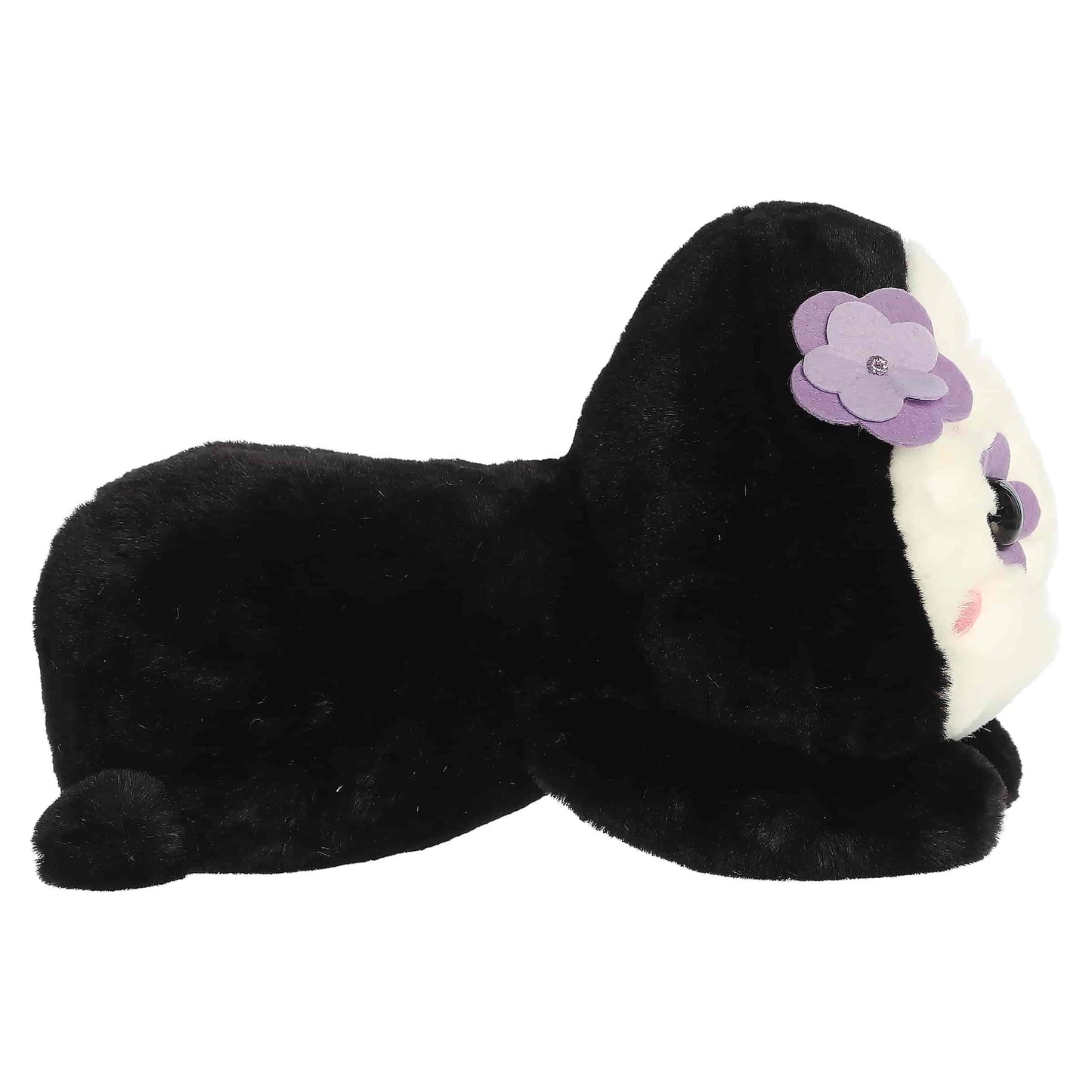 Aurora Too Cute Sissy Sugar Skull plush lying belly-down featuring a white face with colorful embroidered floral patterns and a purple 3D flower.
