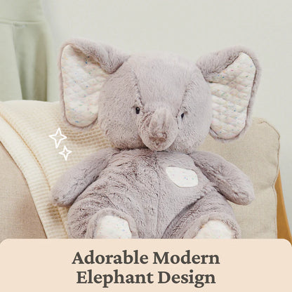 Plush elephant toy on a beige chair with text 'Adorable Modern Elephant Design'.