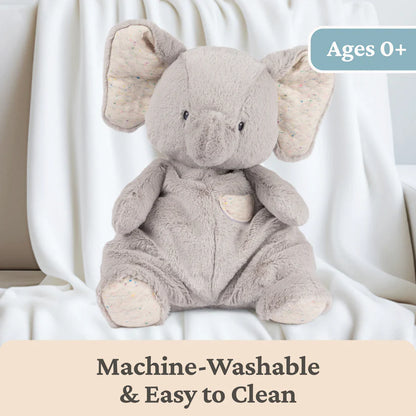Plush elephant toy on a white background with text indicating machine-washability and age suitability.
