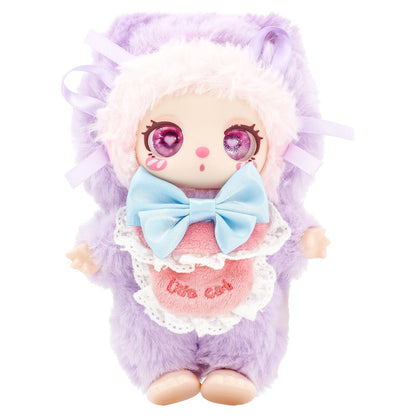 Plush toy with purple fur, pink eyes, and a blue bow on a white background