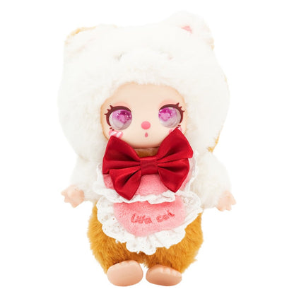 Toy resembling a hamster with a red bow and white outfit on a white background