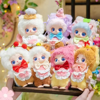 A group shot of the 7 adorable plush dolls from the Baby Three Liila V4 Pastry Chef Kitten collectible series, held in a wooden tray.