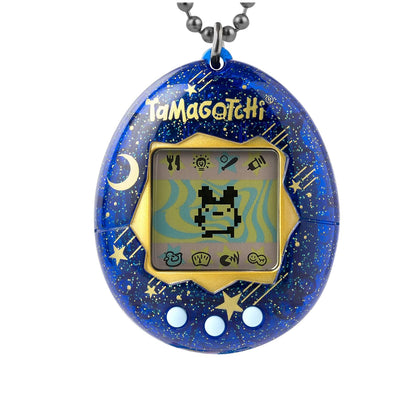 A Tamagotchi keychain toy in a blue space-themed design with gold stars, a crescent moon, and a gold border around the screen, shown on a white background with a metal ball chain attached.
