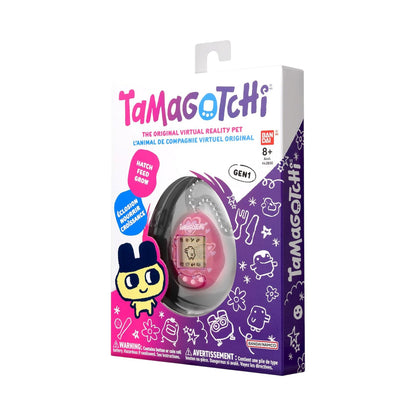 Tamagotchi GEN 1 virtual reality pet toy in its original retail packaging, featuring a pink handheld device visible through a clear window on a white, purple, and pink box.