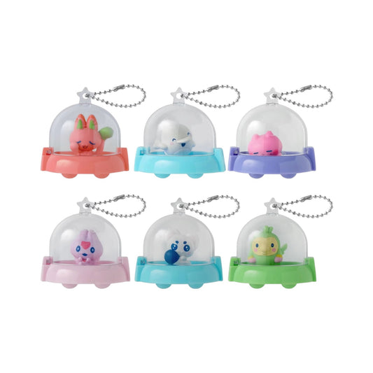 Bandai Tamagotchi Collectibles Paradise Series Vol. 2 blind bag packaging and UFO capsule cases displaying miniature figures.