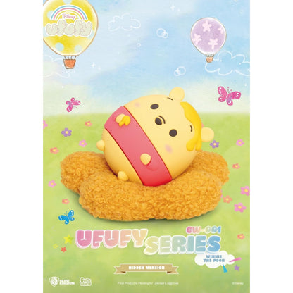 Winnie the Pooh Ufufy figure on an orange cushion