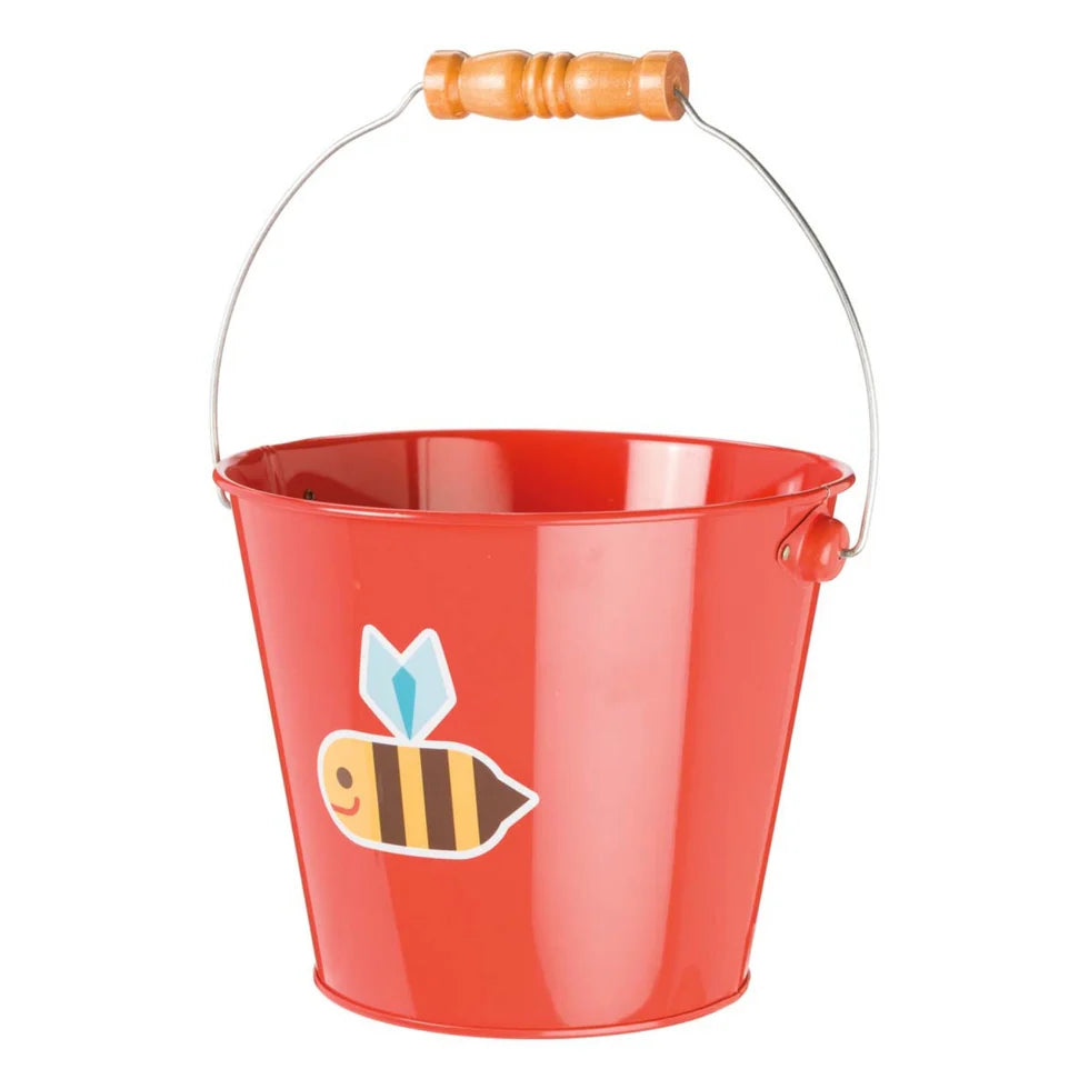 Red pail with a bee design and wooden handle on a white background