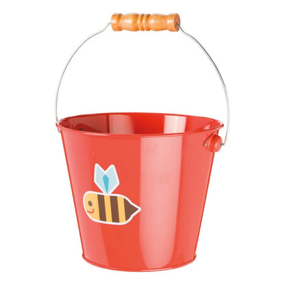 Red pail with a bee design and wooden handle on a white background
