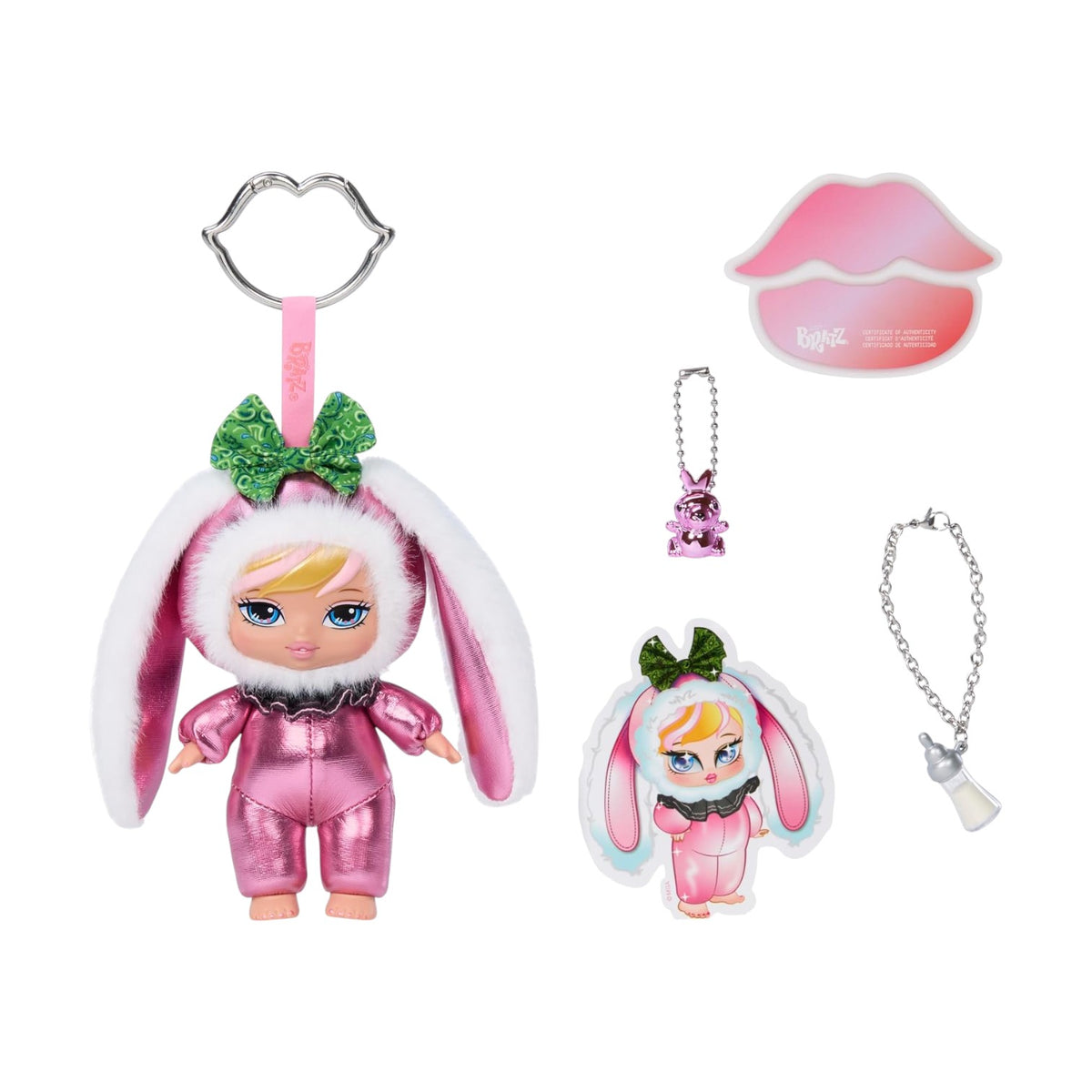 A doll keychain set featuring a pink bunny costume doll with long white bunny ears and a green glitter bow, shown with a lip-shaped accessory, a small pink bunny charm, and a silver chain necklace on a white background.