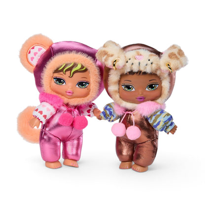 Two small fashion dolls standing side by side on a plain white background. The doll on the left wears a shiny pink outfit with a fuzzy pink hood and tail.
