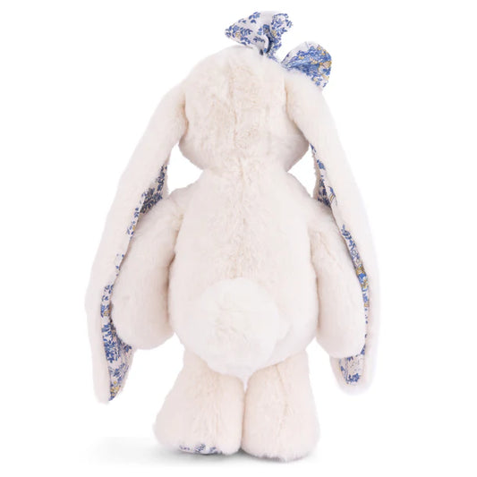 Friendly Kanina white bunny plush by Bukowski Bears, featuring long floppy ears and a bow in a blue floral pattern.