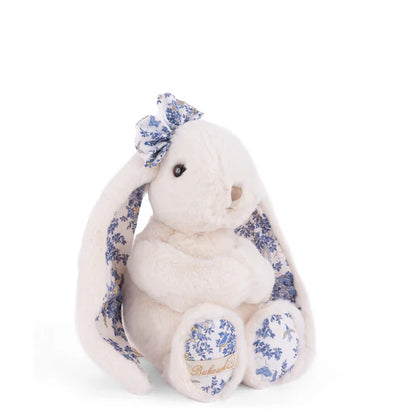Friendly Kanina white bunny plush by Bukowski Bears, featuring long floppy ears and a bow in a blue floral pattern.
