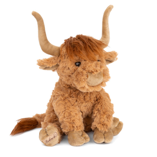 Bukowski Bears Henderson 12-inch highland cow plush sitting in the grass, featuring shaggy warm earthy-toned fur and curved horns.