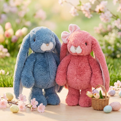 Two plush bunny toys, one blue and one pink, standing outdoors with flowers and a basket.