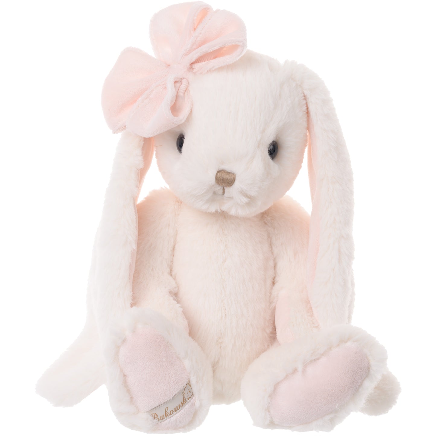 Bukowski Bears Lilibet cream-colored plush bunny featuring soft pink accents, long floppy ears, and a light pink bow on her head.