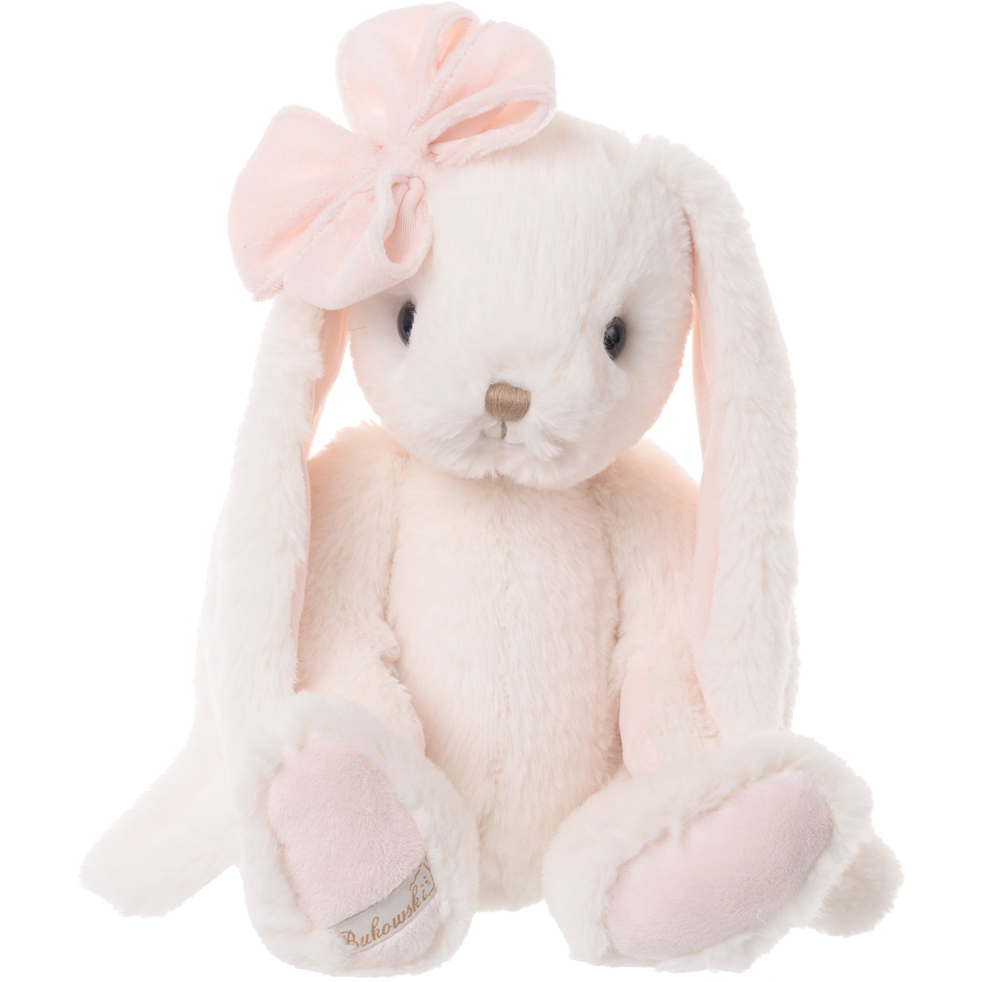 Bukowski Bears Lilibet cream-colored plush bunny featuring soft pink accents, long floppy ears, and a light pink bow on her head.