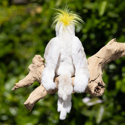 Bukowski Bears Mango cockatoo plush featuring brilliant white feathers, a striking yellow crest on its head, and a dark grey beak.