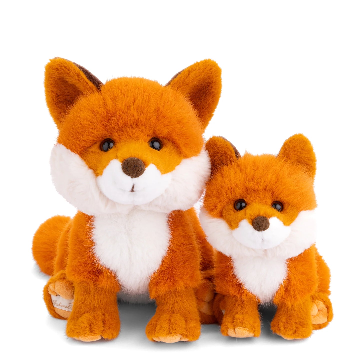 Bukowski Bears Sweet Clever Fox plush sitting down, featuring a vibrant orange coat, a fluffy white chest, and a bushy tail.