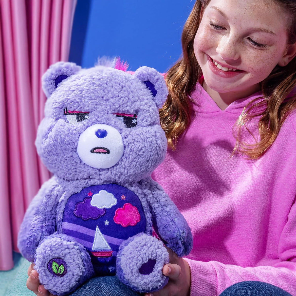 Care Bears Cozy Stormy Heart Bear soft purple sherpa plush stuffed toy featuring a brooding expression and a sailboat belly badge.