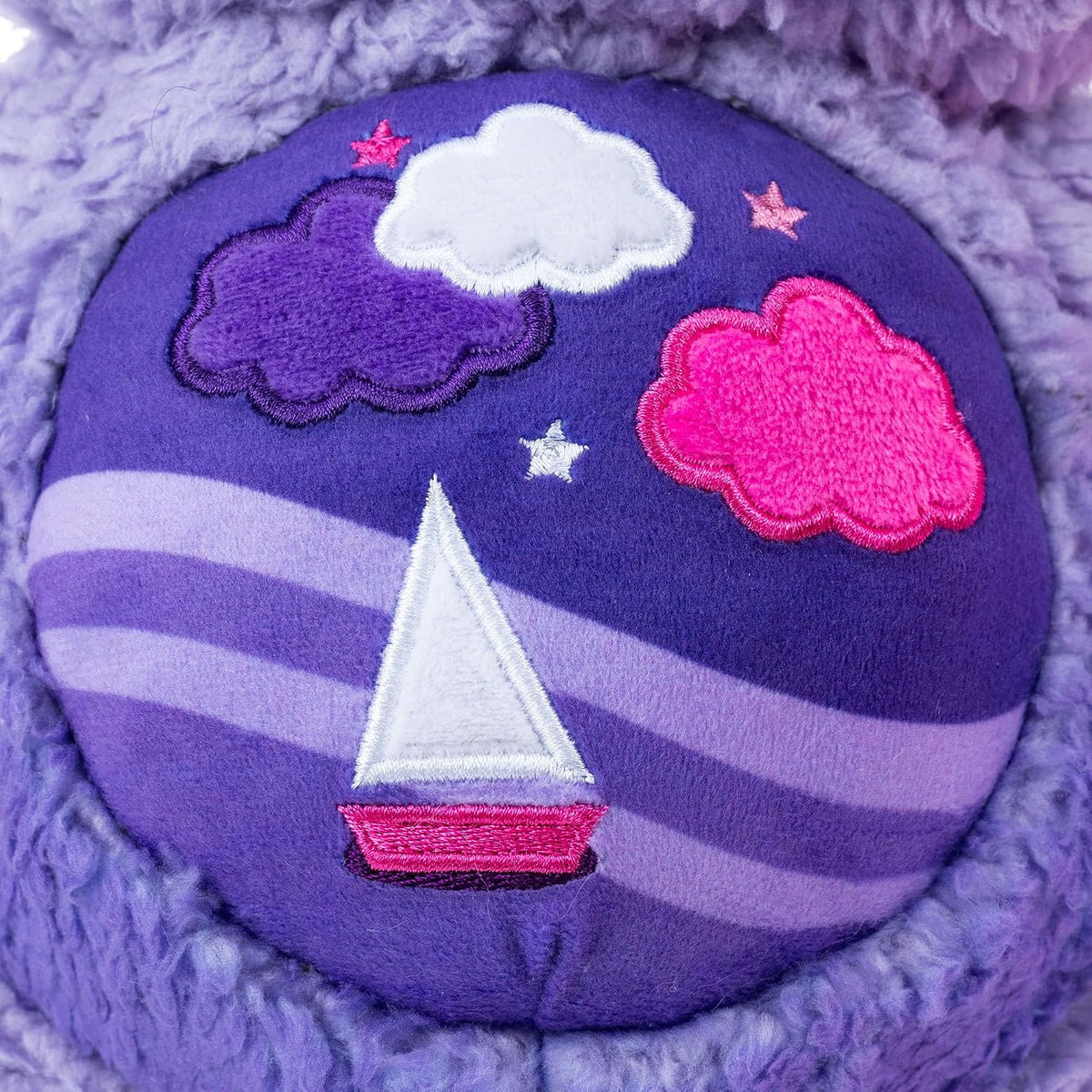 Care Bears Cozy Stormy Heart Bear soft purple sherpa plush stuffed toy featuring a brooding expression and a sailboat belly badge.