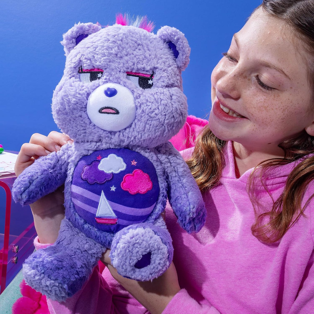 Care Bears Cozy Stormy Heart Bear soft purple sherpa plush stuffed toy featuring a brooding expression and a sailboat belly badge.