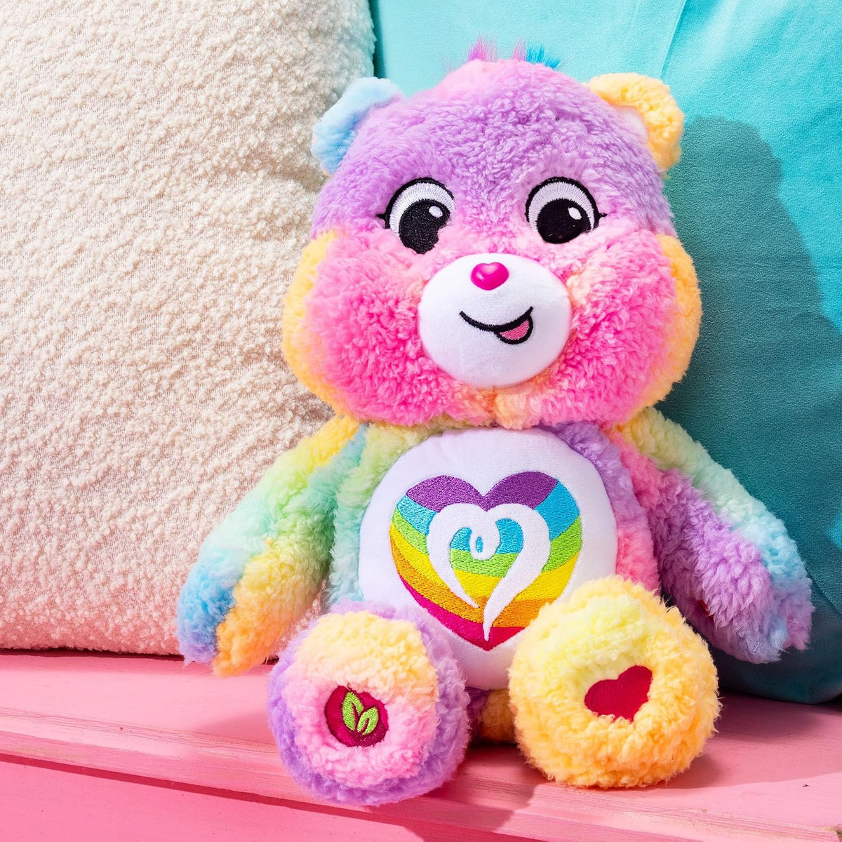Care Bears Cozy Togetherness Bear soft rainbow sherpa plush stuffed toy featuring a dazzling embroidered rainbow heart belly badge.