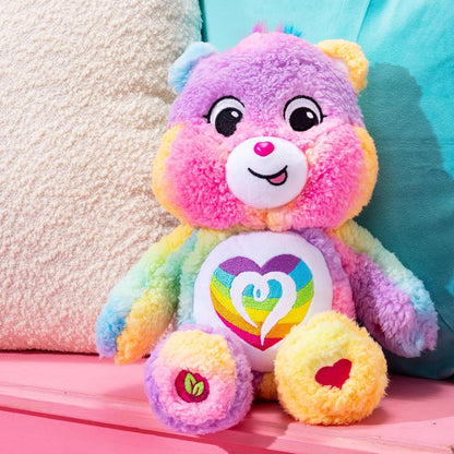 Care Bears Cozy Togetherness Bear soft rainbow sherpa plush stuffed toy featuring a dazzling embroidered rainbow heart belly badge.