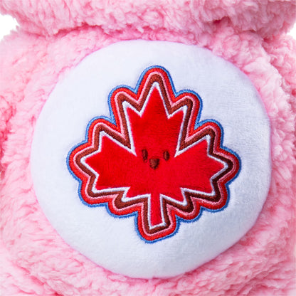 Pink plush toy with a red maple leaf design on a white background