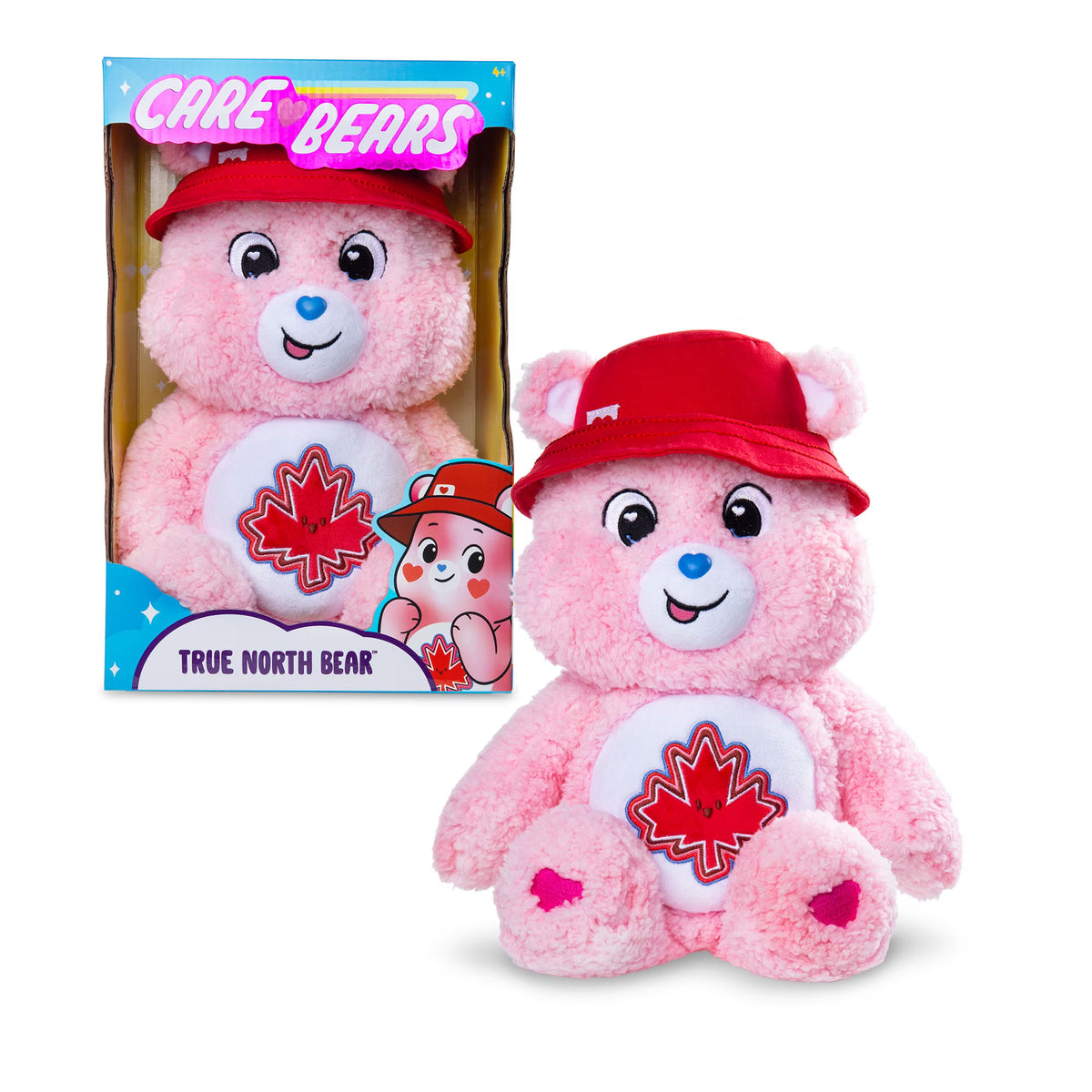 Care Bears True North Bear 4.0 soft pink plush stuffed toy wearing a red hat and featuring a red maple leaf belly badge.