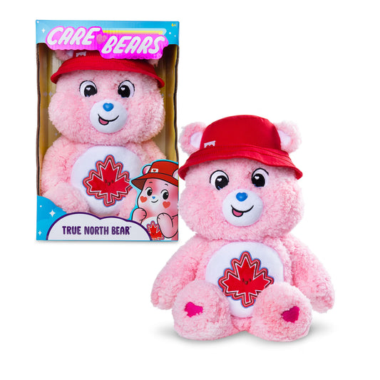 Care Bears True North Bear 4.0 soft pink plush stuffed toy wearing a red hat and featuring a red maple leaf belly badge.