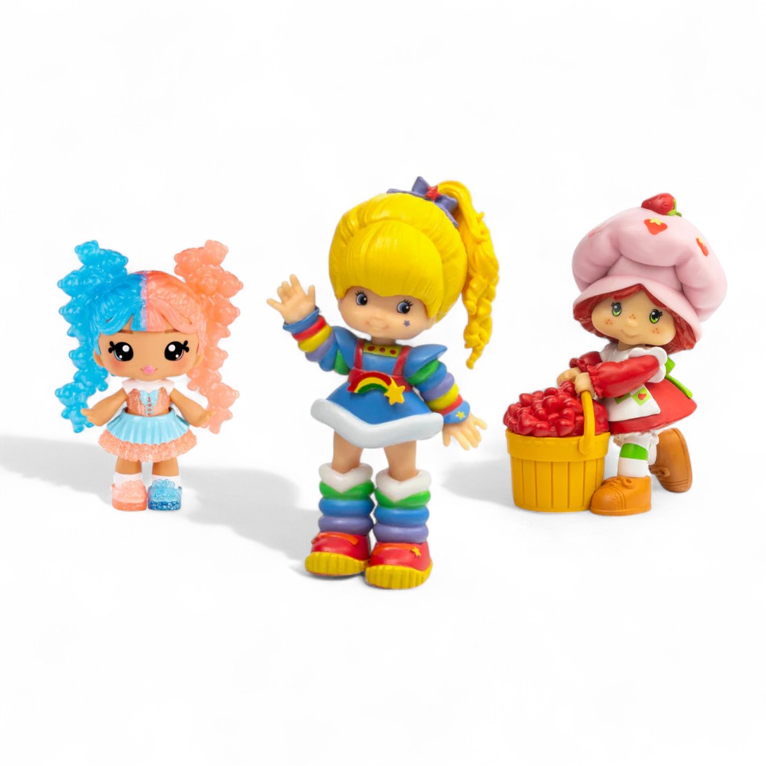 Three bright small collectible figurines.