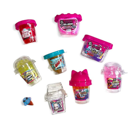 Assorted toy containers with colorful lids on a white background