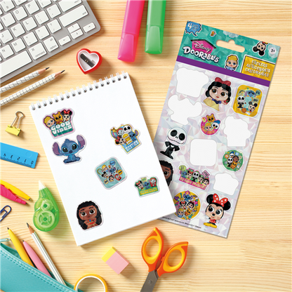 Sheet of Disney stickers with a package on a desk with stationery items