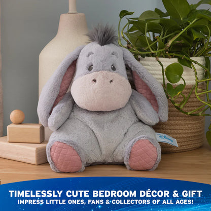 Plush toy donkey on a wooden surface with decorative items and text about decor and gift.