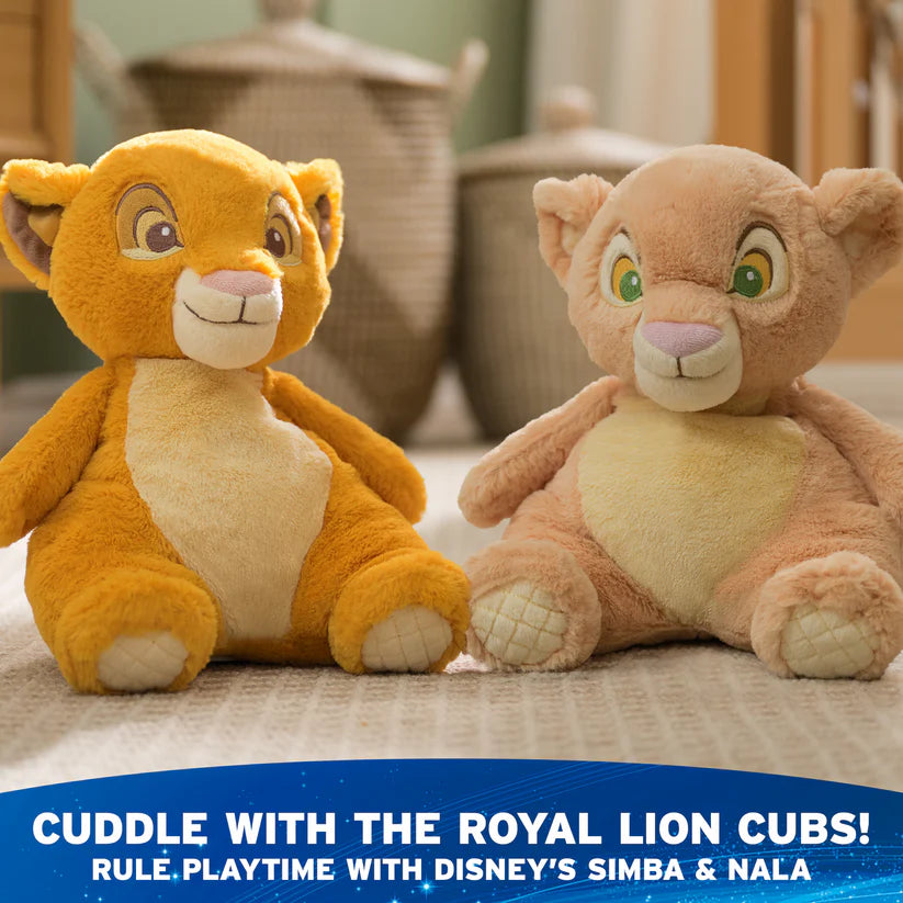 Two plush toys resembling Simba and Nala from Disney's The Lion King on a textured surface with a blurred background.