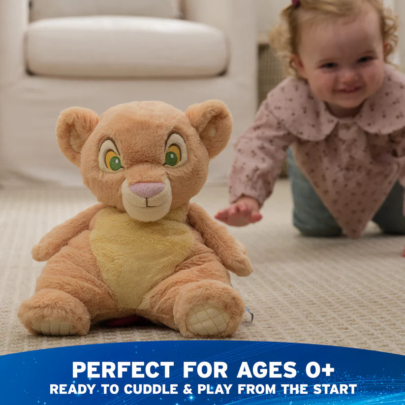 Plush toy lion with a child in the background, text indicating suitability for ages 0+