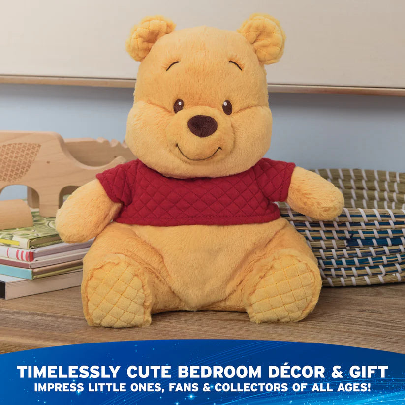 Plush bear toy with a red shirt on a wooden surface with text about decor and gift.