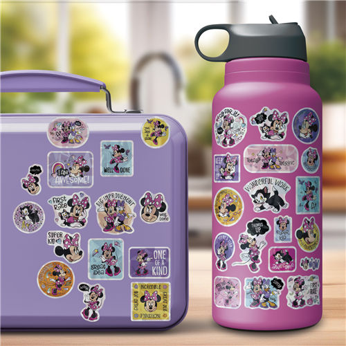 Purple lunch box and water bottle with Minnie Mouse stickers on a blurred outdoor background