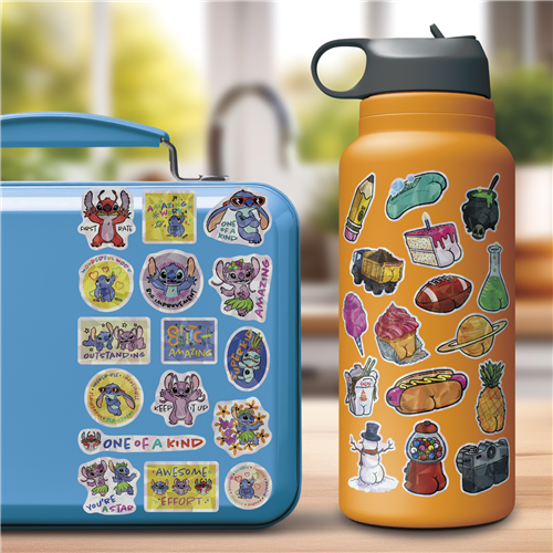 Blue lunch box and orange water bottle with colorful stickers on a blurred background