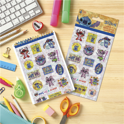 Stitch-themed sticker sheets on a desk with stationery items