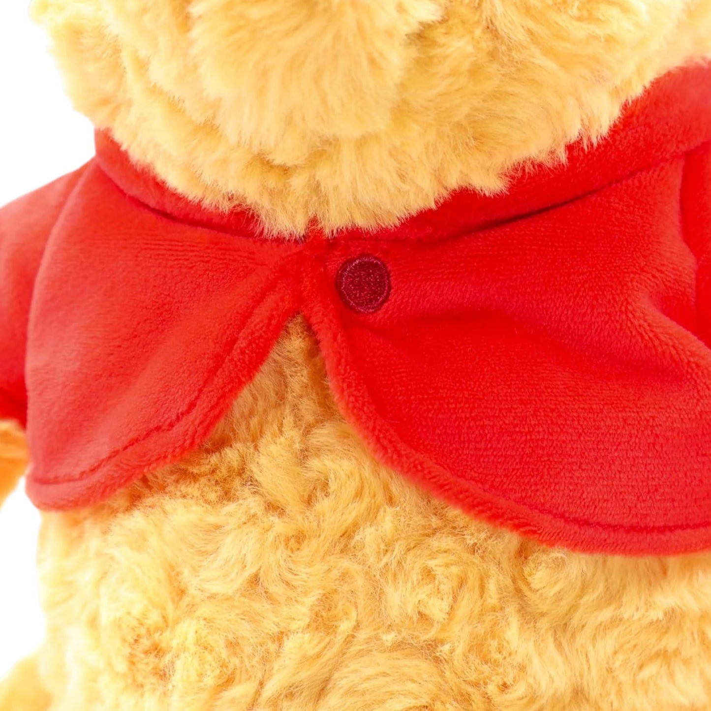Disney Winnie the Pooh 100th Anniversary plush featuring textured rose-swirl fur and a red velvet cardigan.
