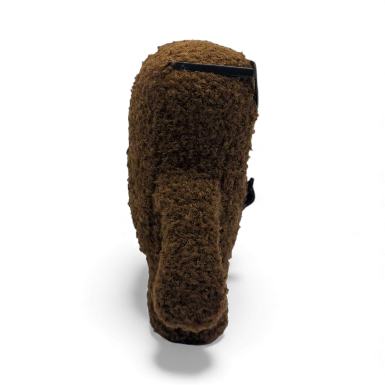 Side view of the 6.5-inch Domo plush dressed as a nerd, wearing thick black glasses with tape on the bridge and a black bow tie.